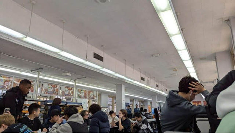 Students in the cafeteria awaiting release from the hold